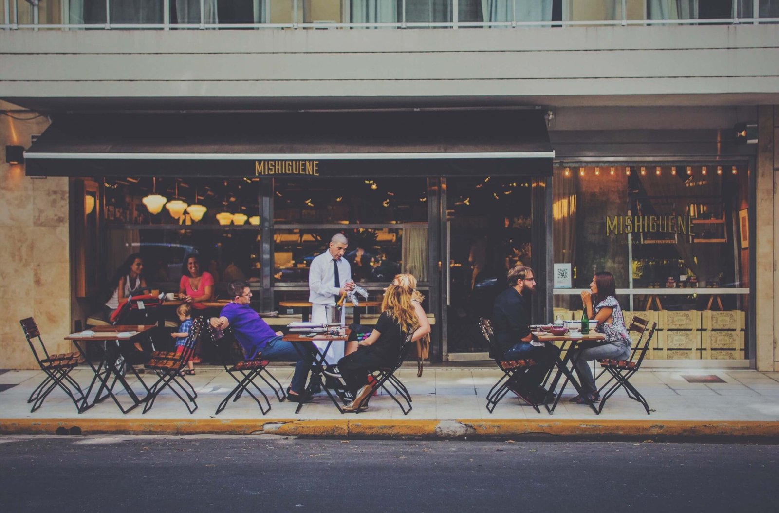 People at Coffee Shop sitting Outside People at Coffee Shop sitting Outside
